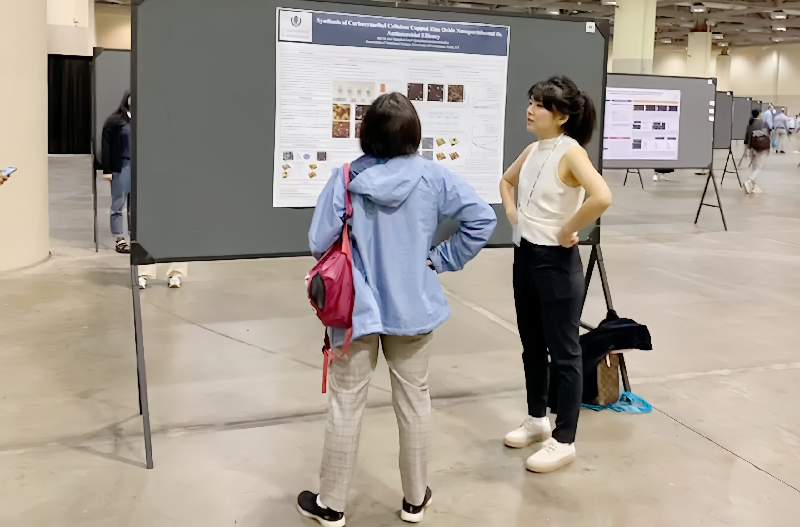 Bai presenting her poster